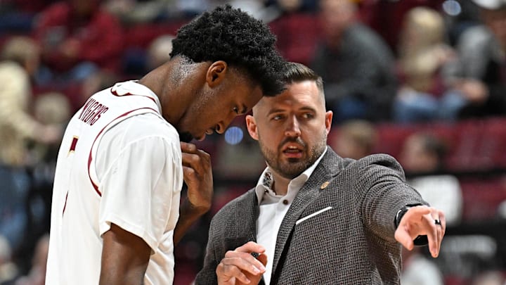 Jan 17, 2026; Tallahassee, Florida, USA; Florida State Seminoles head coach Luke Loucks talks with forward Chauncey Wiggins (7) during the first half against the Wake Forest Demon Deacons at Donald L. Tucker Center. Mandatory Credit: Melina Myers-Imagn Images