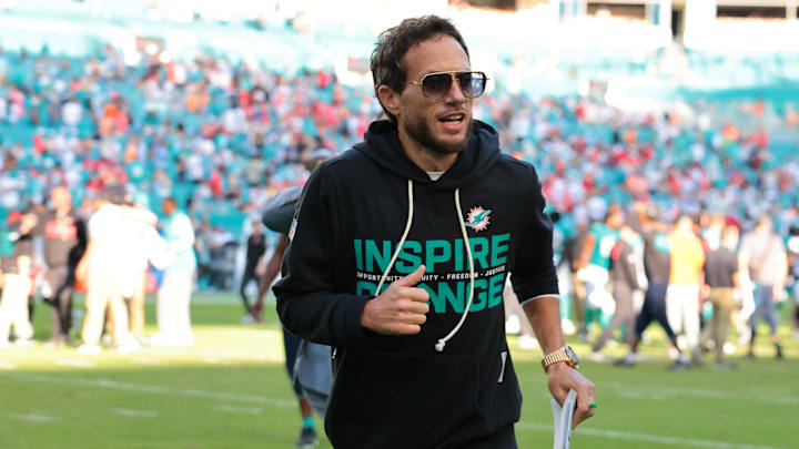 Dec 28, 2025; Miami Gardens, Florida, USA; Miami Dolphins head coach Mike McDaniel runs off the field following a win over the Tampa Bay Buccaneers at Hard Rock Stadium. Mandatory Credit: Sam Navarro-Imagn Images