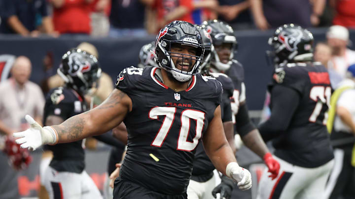 Sep 29, 2024; Houston, Texas, USA; Houston Texans center Juice Scruggs (70) celebrates a Texans running back Dare Ogunbowale (33) touchdown against the Jacksonville Jaguars in the second half at NRG Stadium. Mandatory Credit: Thomas Shea-Imagn Images Sep 29, 2024; Houston, Texas, USA; Houston Texans center Juice Scruggs (70) celebrates a Texans running back Dare Ogunbowale (33) touchdown against the Jacksonville Jaguars in the second half at NRG Stadium. Mandatory Credit: Thomas Shea-Imagn Images