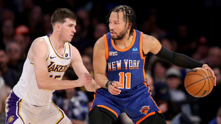 Feb 3, 2024; New York, New York, USA; New York Knicks guard Jalen Brunson (11) controls the ball against Los Angeles Lakers guard Austin Reaves (15) during the second quarter at Madison Square Garden. Mandatory Credit: Brad Penner-USA TODAY Sports