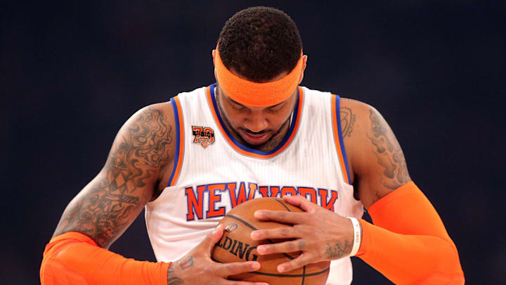 Apr 6, 2017; New York, NY, USA; New York Knicks small forward Carmelo Anthony (7) inspects the ball before a game against the Washington Wizards at Madison Square Garden. Mandatory Credit: Brad Penner-Imagn Images