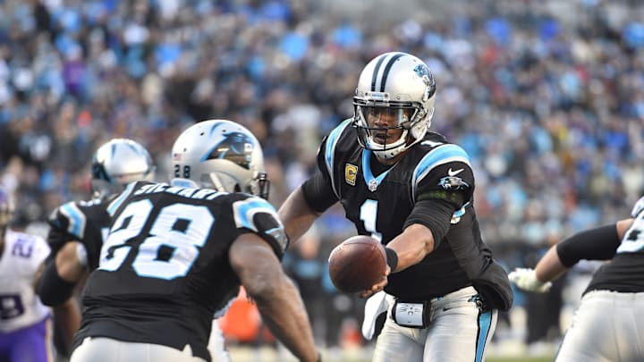 Dec 10, 2017; Charlotte, NC, USA; Carolina Panthers quarterback Cam Newton (1) hands the ball off to running back Jonathan Stewart (28) in the fourth quarter at Bank of America Stadium. Mandatory Credit: Bob Donnan-Imagn Images