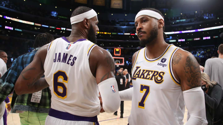 Oct 24, 2021; Los Angeles, California, USA; Los Angeles Lakers forward LeBron James (6) and forward Carmelo Anthony (7) celebrate a win after beating the Memphis Grizzlies 121-118 at Staples Center.  Mandatory Credit: Kiyoshi Mio-USA TODAY Sports