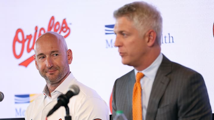Nov 4, 2025; Baltimore, MD, USA; Left: Craig Albernaz looks at Right: President of Baseball Operations Mike Elias after being introduced as the Baltimore Orioles new Manager at Warehouse Bar. Mandatory Credit: Daniel Kucin Jr.-Imagn Images