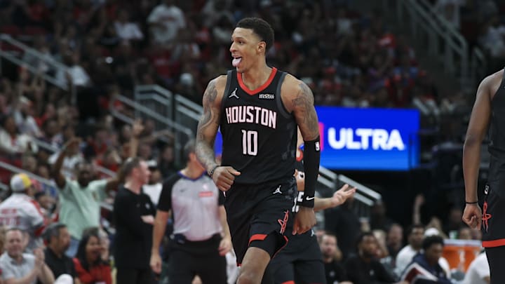 Nov 21, 2025; Houston, Texas, USA; Houston Rockets forward Jabari Smith Jr. (10) reacts after making a basket during the fourth quarter against the Denver Nuggets at Toyota Center. Mandatory Credit: Troy Taormina-Imagn Images