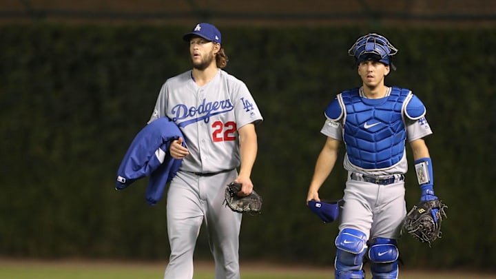Los Angeles Dodgers starting pitcher Clayton Kershaw and catcher Austin Barnes walk to the dugout before game five of the 2017 NLCS.