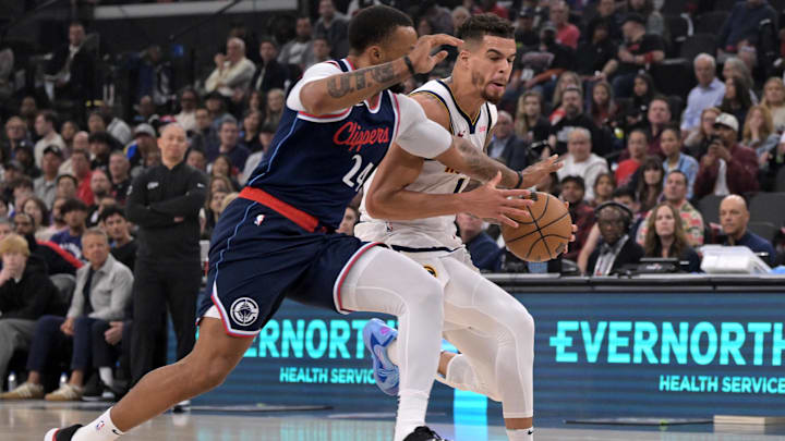 Apr 26, 2025; Inglewood, California, USA; Denver Nuggets forward Michael Porter Jr. (1) is defended by Los Angeles Clippers guard Norman Powell (24) in the first half of game four of round one of the 2024 NBA Playoffs at Intuit Dome. Mandatory Credit: Jayne Kamin-Oncea-Imagn Images