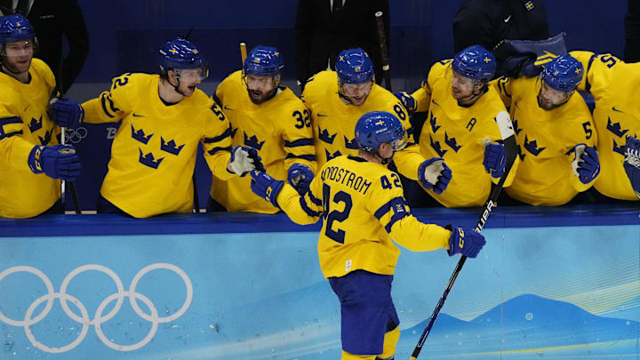 Feb 18, 2022; Beijing, China; Team Sweden forward Joakim Nordstrom (42) celebrates with teammates after scoring a goal against Team ROC in a shootout during the Beijing 2022 Olympic Winter Games at National Indoor Stadium. Mandatory Credit: George Walker IV-Imagn Images