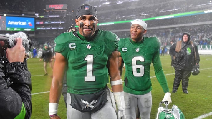 Nov 26, 2023; Philadelphia, Pennsylvania, USA; Philadelphia Eagles quarterback Jalen Hurts (1) snd wide receiver DeVonta Smith (6) walk off the field after overtime win against the Buffalo Bills at Lincoln Financial Field. Mandatory Credit: Eric Hartline-Imagn Images