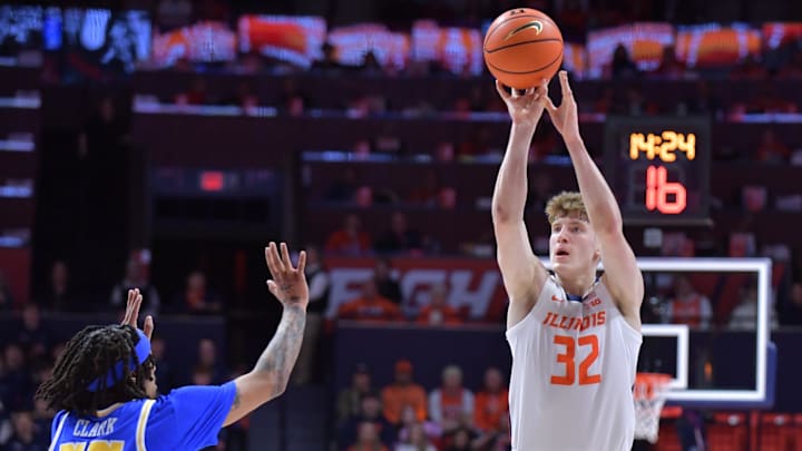 Feb 11, 2025; Champaign, Illinois, USA;  Illinois Fighting Illini guard Kasparas Jakucionis (32) shoots the ball over UCLA Bruins guard Skyy Clark (55) during the first half at State Farm Center. Mandatory Credit: Ron Johnson-Imagn Images