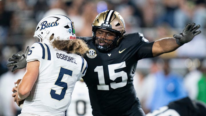 Vanderbilt defensive lineman Zaylin Wood (15) sacks Charleston Southern quarterback Zolten Osborne (5) during their game at FirstBank Stadium in Nashville, Tenn., Saturday, Aug. 30, 2025.