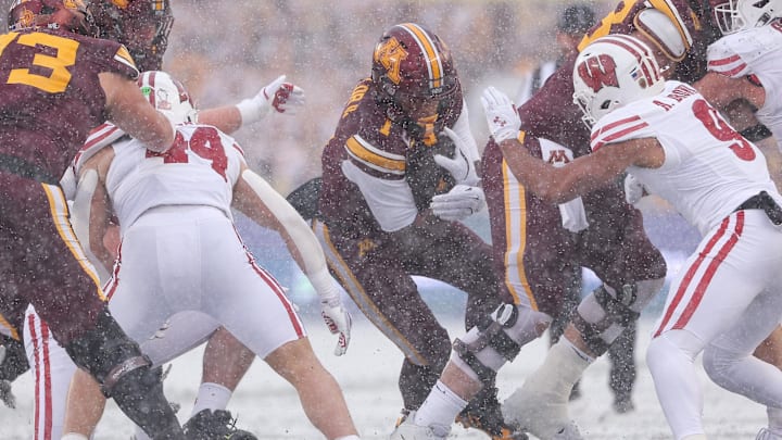 Nov 29, 2025; Minneapolis, Minnesota, USA; Minnesota Golden Gophers running back Darius Taylor (1) runs the ball against the Wisconsin Badgers during the first half at Huntington Bank Stadium. Mandatory Credit: Matt Krohn-Imagn Images