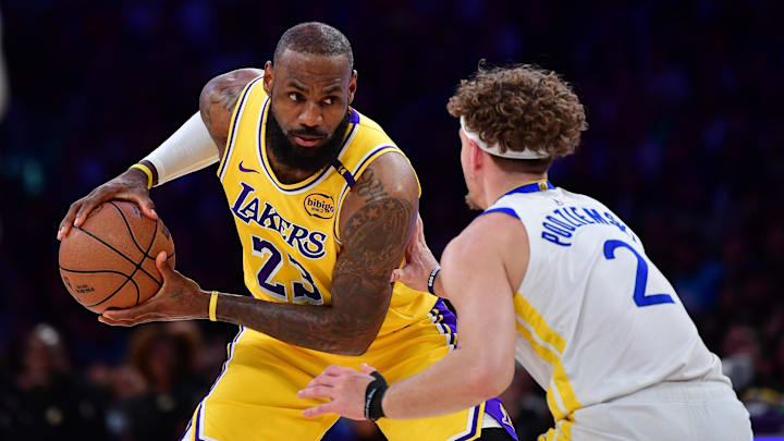 Apr 3, 2025; Los Angeles, California, USA; Los Angeles Lakers forward LeBron James (23) controls the ball against Golden State Warriors guard Brandin Podziemski (2) during the first half at Crypto.com Arena. Mandatory Credit: Gary A. Vasquez-Imagn Images Apr 3, 2025; Los Angeles, California, USA; Los Angeles Lakers forward LeBron James (23) controls the ball against Golden State Warriors guard Brandin Podziemski (2) during the first half at Crypto.com Arena. Mandatory Credit: Gary A. Vasquez-Imagn Images
