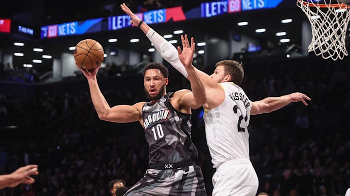 Dec 21, 2024; Brooklyn, New York, USA;  Brooklyn Nets guard Ben Simmons (10) passes the ball against Utah Jazz center Walker Kessler (24) in the first quarter at Barclays Center. Mandatory Credit: Wendell Cruz-Imagn Images