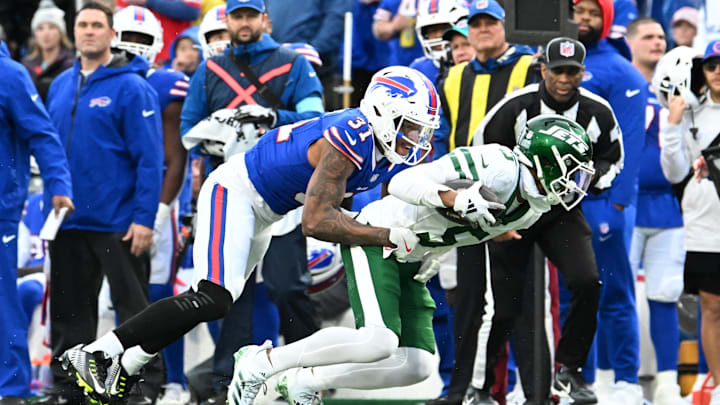 New York Jets wide receiver Garrett Wilson (5) is tackled by Buffalo Bills cornerback Rasul Douglas (31) after making a catch
