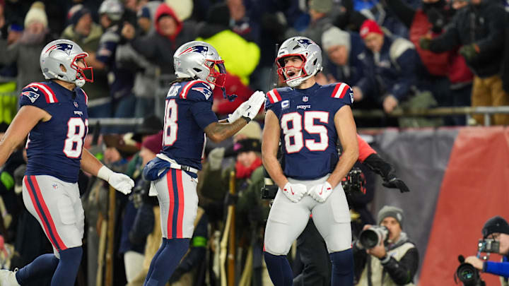 Jan 11, 2026; Foxborough, MA, USA; New England Patriots tight end Hunter Henry (85) celebrates with New England Patriots wide receiver Kyle Williams (18) after scoring a touchdown during the fourth quarter against the Los Angeles Chargers in an AFC Wild Card Round game at Gillette Stadium.