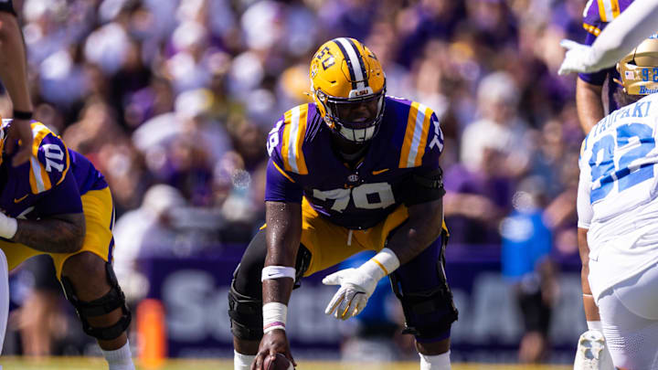 Sep 21, 2024; Baton Rouge, Louisiana, USA;  LSU Tigers offensive lineman DJ Chester (79) waits to snap the ball against UCLA Bruins defensive lineman Siale Taupaki (92) during the first half at Tiger Stadium. Mandatory Credit: Stephen Lew-Imagn Images