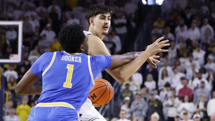 Feb 14, 2026; Ann Arbor, Michigan, USA; Michigan Wolverines center Aday Mara (15) is defended by UCLA Bruins forward Xavier Booker (1) in the first half at Crisler Center. Mandatory Credit: Rick Osentoski-Imagn Images Feb 14, 2026; Ann Arbor, Michigan, USA; Michigan Wolverines center Aday Mara (15) is defended by UCLA Bruins forward Xavier Booker (1) in the first half at Crisler Center. Mandatory Credit: Rick Osentoski-Imagn Images