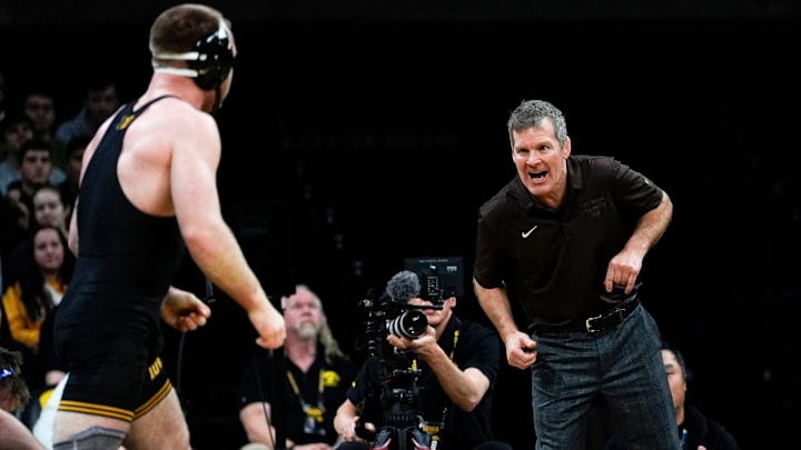 Iowa head coach Tom Brands instructs Patrick Kennedy during a 174-pound match against Pittsburgh Nov. 21, 2025 during a dual at Carver-Hawkeye Arena in Iowa City, Iowa. Iowa head coach Tom Brands instructs Patrick Kennedy during a 174-pound match against Pittsburgh Nov. 21, 2025 during a dual at Carver-Hawkeye Arena in Iowa City, Iowa.