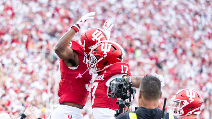 Nov 9, 2024; Bloomington, Indiana, USA; Indiana Hoosiers wide receiver Omar Cooper Jr.  celebrates his touchdown with teammates in the first quarter against the Michigan Wolverines at Memorial Stadium. Mandatory Credit: Trevor Ruszkowski-Imagn Images