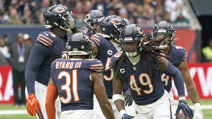 Oct 13, 2024; London, United Kingdom; Chicago Bears linebacker Tremaine Edmunds (49) and teammates celebrate a turnover during the first half of an NFL International Series game at Tottenham Hotspur Stadium. Mandatory Credit: Peter van den Berg-Imagn Images