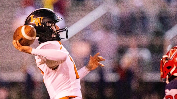 Lake Wales High School quarterback Max Seidl (16) throws to an open receiver on a trick play in the first half. The Vanguard Knights hosted The Lake Wales Highlanders at Booster Stadium in Ocala, FL on Friday, November 22, 2024. [Doug Engle/Ocala Star Banner]
