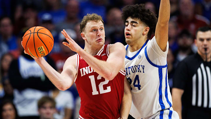 Dec 13, 2025; Lexington, Kentucky, USA; Indiana Hoosiers forward Tucker Devries (12) passes the ball against Kentucky Wildcats center Malachi Moreno (24) during the second half at Rupp Arena at Central Bank Center. Mandatory Credit: Jordan Prather-Imagn Images Dec 13, 2025; Lexington, Kentucky, USA; Indiana Hoosiers forward Tucker Devries (12) passes the ball against Kentucky Wildcats center Malachi Moreno (24) during the second half at Rupp Arena at Central Bank Center. Mandatory Credit: Jordan Prather-Imagn Images