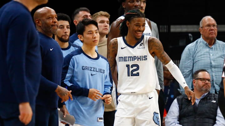 Nov 25, 2024; Memphis, Tennessee, USA; Memphis Grizzlies guard Yuki Kawamura (17) and guard Ja Morant (12) watch from the bench during the second half against the Portland Trail Blazers at FedExForum. Mandatory Credit: Petre Thomas-Imagn Images