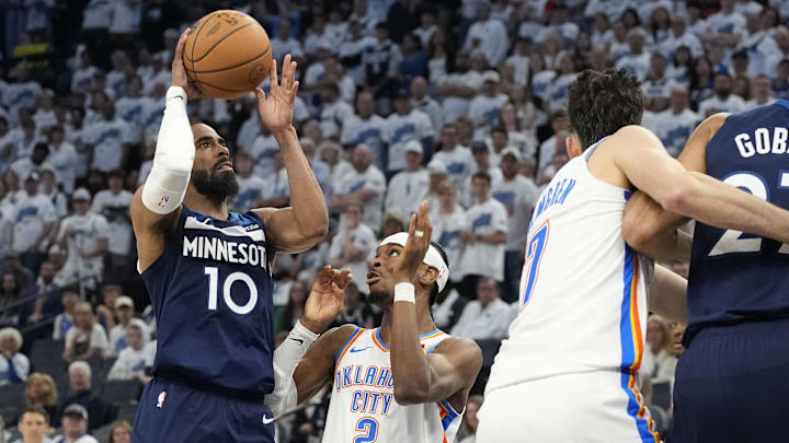 May 26, 2025; Minneapolis, Minnesota, USA; Minnesota Timberwolves guard Mike Conley (10) shoots the ball past Oklahoma City Thunder guard Shai Gilgeous-Alexander (2) in the second half during game four of the western conference finals for the 2025 NBA Playoffs at Target Center. Mandatory Credit: Bruce Kluckhohn-Imagn Images May 26, 2025; Minneapolis, Minnesota, USA; Minnesota Timberwolves guard Mike Conley (10) shoots the ball past Oklahoma City Thunder guard Shai Gilgeous-Alexander (2) in the second half during game four of the western conference finals for the 2025 NBA Playoffs at Target Center. Mandatory Credit: Bruce Kluckhohn-Imagn Images