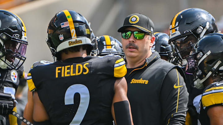 Sep 22, 2024; Pittsburgh, Pennsylvania, USA; Pittsburgh Steelers offensive coordinator Arthur Smith talks with quarterback Russell Wilson (3) during warmups for a game against the Los Angeles Chargers at Acrisure Stadium. Mandatory Credit: Barry Reeger-Imagn Images