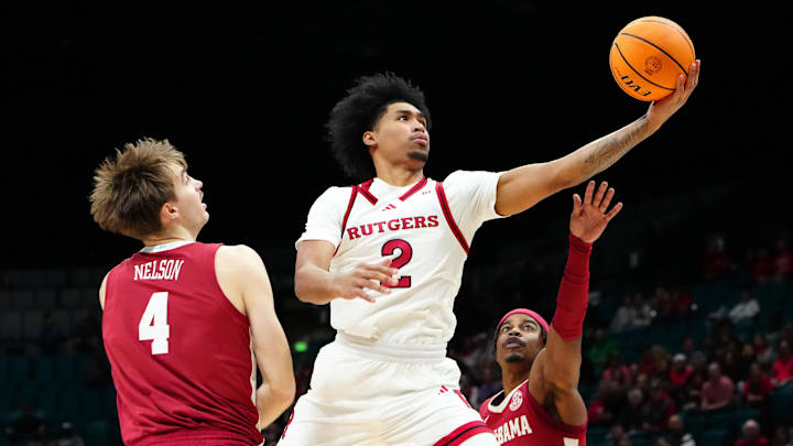 Nov 27, 2024; Las Vegas, Nevada, USA; Rutgers Scarlet Knights guard Dylan Harper (2) shoots between Alabama Crimson Tide forward Grant Nelson (4) and Alabama Crimson Tide forward Jarin Stevenson (15) during the first half at MGM Grand Garden Arena. Mandatory Credit: Stephen R. Sylvanie-Imagn Images Nov 27, 2024; Las Vegas, Nevada, USA; Rutgers Scarlet Knights guard Dylan Harper (2) shoots between Alabama Crimson Tide forward Grant Nelson (4) and Alabama Crimson Tide forward Jarin Stevenson (15) during the first half at MGM Grand Garden Arena. Mandatory Credit: Stephen R. Sylvanie-Imagn Images