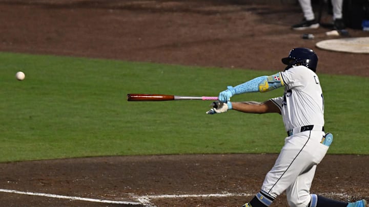 Tampa Bay Rays third baseman Junior Caminero (13) hits a RBI single in the fourth inning against the Baltimore Orioles at George M. Steinbrenner Field on June 17. Tampa Bay Rays third baseman Junior Caminero (13) hits a RBI single in the fourth inning against the Baltimore Orioles at George M. Steinbrenner Field on June 17.