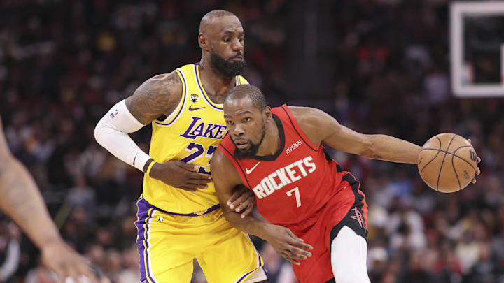 Mar 16, 2026; Houston, Texas, USA; Houston Rockets forward Kevin Durant (7) dribbles the ball as Los Angeles Lakers forward LeBron James (23) defends during the first quarter at Toyota Center. Mandatory Credit: Troy Taormina-Imagn Images