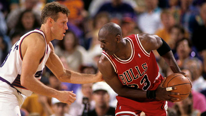 Suns guard Dan Majerle defends Bulls guard Michael Jordan during Game 1 of the NBA Finals in 1993 in Phoenix.