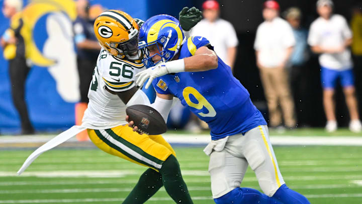Oct 6, 2024; Inglewood, California, USA; Green Bay Packers linebacker Edgerrin Cooper (56) sacks Los Angeles Rams quarterback Matthew Stafford (9) during the second quarter at SoFi Stadium. Mandatory Credit: Robert Hanashiro-Imagn Images