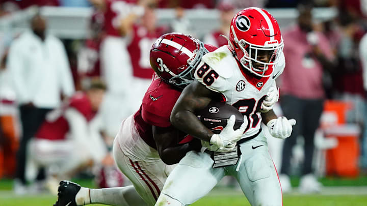 Sep 28, 2024; Tuscaloosa, Alabama, USA; Georgia Bulldogs wide receiver Dillon Bell (86) runs the ball against Alabama Crimson Tide defensive back Keon Sabb (3) during the fourth quarter at Bryant-Denny Stadium. Mandatory Credit: John David Mercer-Imagn Images Sep 28, 2024; Tuscaloosa, Alabama, USA; Georgia Bulldogs wide receiver Dillon Bell (86) runs the ball against Alabama Crimson Tide defensive back Keon Sabb (3) during the fourth quarter at Bryant-Denny Stadium. Mandatory Credit: John David Mercer-Imagn Images
