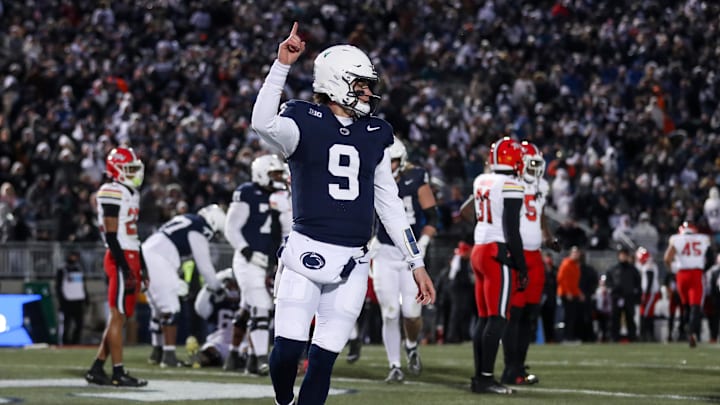Nov 30, 2024; University Park, Pennsylvania, USA; Penn State Nittany Lions quarterback Beau Pribula (9) celebrates after scoring a touchdown against the Maryland Terrapins during the second quarter at Beaver Stadium. Mandatory Credit: Matthew O'Haren-Imagn Images