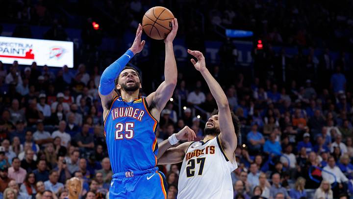 Mar 9, 2026; Oklahoma City, Oklahoma, USA; Oklahoma City Thunder guard Ajay Mitchell (25) goes up for a basket beside Denver Nuggets guard Jamal Murray (27) during the second half at Paycom Center. Mandatory Credit: Alonzo Adams-Imagn Images Mar 9, 2026; Oklahoma City, Oklahoma, USA; Oklahoma City Thunder guard Ajay Mitchell (25) goes up for a basket beside Denver Nuggets guard Jamal Murray (27) during the second half at Paycom Center. Mandatory Credit: Alonzo Adams-Imagn Images