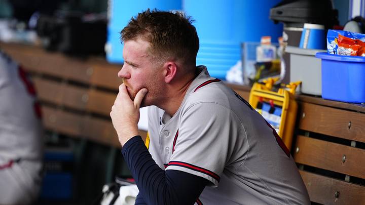 May 3, 2026; Denver, Colorado, USA; Atlanta Braves pitcher Aaron Bummer (49) on the bench in the fifth inning against the Colorado Rockies at Coors Field. Mandatory Credit: Ron Chenoy-Imagn Images