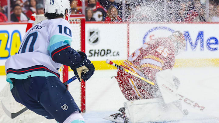 Dec 27, 2023; Calgary, Alberta, CAN; Calgary Flames goaltender Jacob Markstrom (25) makes a save against Seattle Kraken during the third period at Scotiabank Saddledome. Mandatory Credit: Sergei Belski-Imagn Images