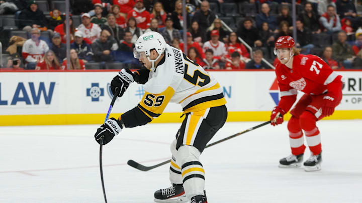 Jan 3, 2026; Detroit, Michigan, USA; Pittsburgh Penguins right wing Yegor Chinakhov (59) scores a goal in the first period against the Detroit Red Wings at Little Caesars Arena. Mandatory Credit: Brian Bradshaw Sevald-Imagn Images