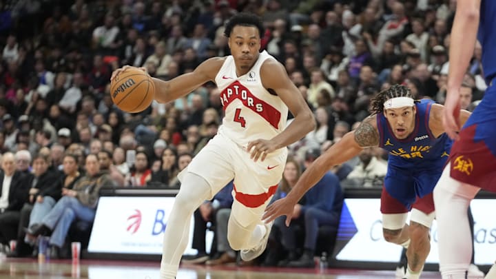 Oct 28, 2024; Toronto, Ontario, CAN; Toronto Raptors forward Scottie Barnes (4) drives to the net against Denver Nuggets forward Aaron Gordon (32) during the second half at Scotiabank Arena. Mandatory Credit: John E. Sokolowski-Imagn Images