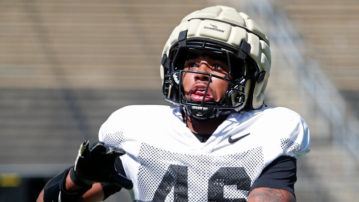 Purdue Boilermakers defensive back Sterling Smith (46) goes for a pass Purdue Boilermakers defensive back Sterling Smith (46) goes for a pass