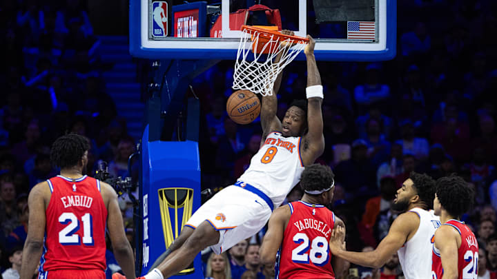 Nov 12, 2024; Philadelphia, Pennsylvania, USA; New York Knicks forward OG Anunoby (8) dunks the ball in front of Philadelphia 76ers center Joel Embiid (21) and forward Guerschon Yabusele (28) during the fourth quarter at Wells Fargo Center. Mandatory Credit: Bill Streicher-Imagn Images Nov 12, 2024; Philadelphia, Pennsylvania, USA; New York Knicks forward OG Anunoby (8) dunks the ball in front of Philadelphia 76ers center Joel Embiid (21) and forward Guerschon Yabusele (28) during the fourth quarter at Wells Fargo Center. Mandatory Credit: Bill Streicher-Imagn Images