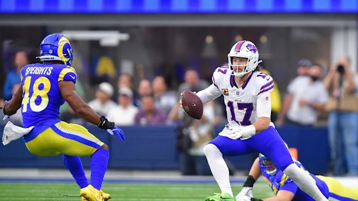 Dec 8, 2024; Inglewood, California, USA; Buffalo Bills quarterback Josh Allen (17) runs the ball against Los Angeles Rams linebacker Omar Speights (48) during the second half at SoFi Stadium. Mandatory Credit: Gary A. Vasquez-Imagn Images