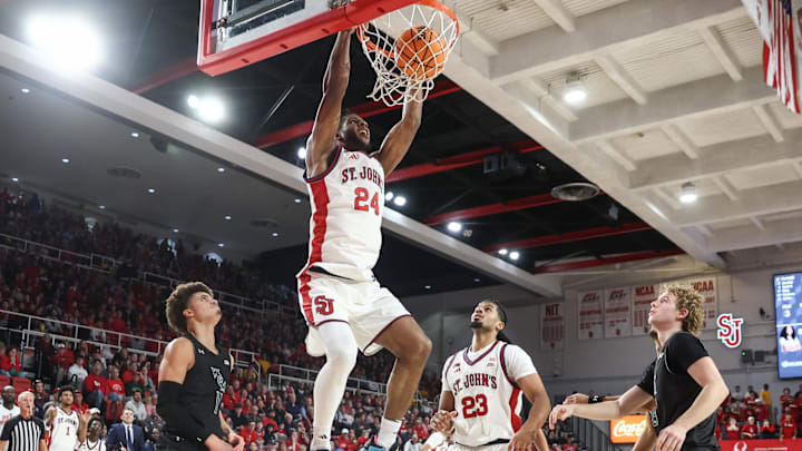Nov 15, 2025; Queens, New York, USA; St. John's basketball forward Zuby Ejiofor (24) dunks in the second half against the William & Mary Tribe at Carnesecca Arena. Nov 15, 2025; Queens, New York, USA; St. John's basketball forward Zuby Ejiofor (24) dunks in the second half against the William & Mary Tribe at Carnesecca Arena.