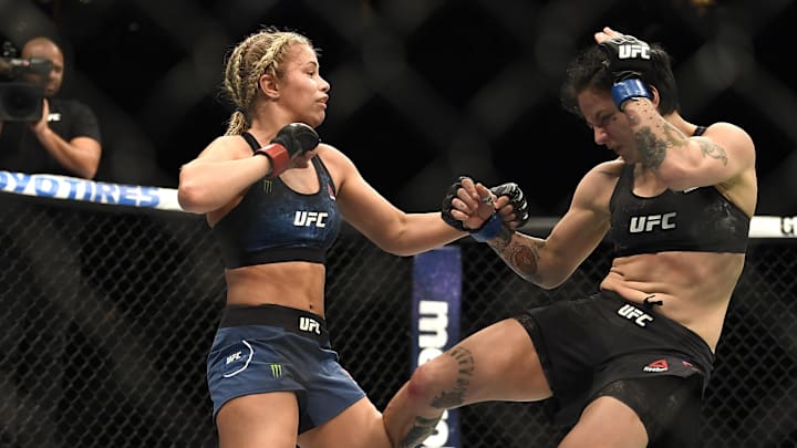 Jessica-Rose Clark (blue gloves) fights Paige VanZant (red gloves) during UFC Fight Night at Scottrade Center. Jessica-Rose Clark (blue gloves) fights Paige VanZant (red gloves) during UFC Fight Night at Scottrade Center.