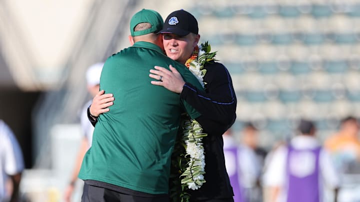 Hawaii Rainbow Warriors head coach Timmy Chang, left, greets the Boise State Broncos head coach Spencer Danielson. Hawaii Rainbow Warriors head coach Timmy Chang, left, greets the Boise State Broncos head coach Spencer Danielson.