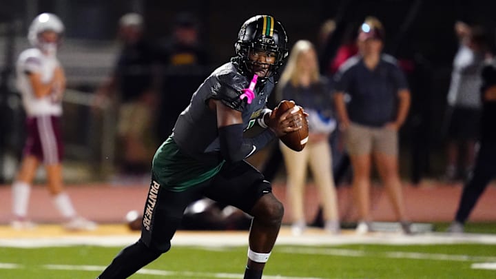 Oct 27, 2023; Fairburn, GA, USA; Langston Hughes Panthers quarterback Air Noland (1) scrambles out