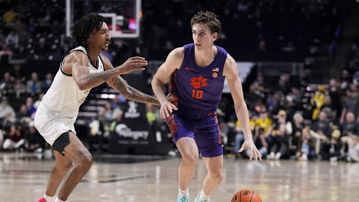 Feb 18, 2026; Winston-Salem, North Carolina, USA; Clemson Tigers forward Jake Wahlin (10) handles the ball defended by Wake Forest Demon Deacons forward Juke Harris (2)during the second half at Lawrence Joel Veterans Memorial Coliseum. Mandatory Credit: Jim Dedmon-Imagn Images